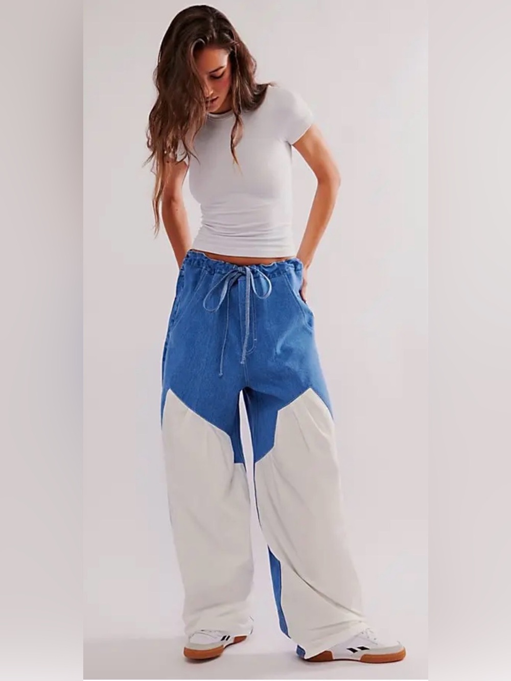 These are the KSENIASCHNAIDER Front White  Panel Wide Leg Medium Wash Jeans
